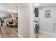Conveniently located laundry area with a stacked washer and dryer unit at 1055 Kensington Park Dr # 111, Altamonte Springs, FL 32714