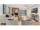 Cozy living room with brick fireplace, stylish furniture, and sliding glass doors to the patio at 1055 Kensington Park Dr # 111, Altamonte Springs, FL 32714