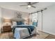 Inviting main bedroom featuring a barn door leading to the ensuite bathroom at 1055 Kensington Park Dr # 111, Altamonte Springs, FL 32714