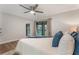 Spacious main bedroom with a ceiling fan and sliding glass doors to the outdoor balcony at 1055 Kensington Park Dr # 111, Altamonte Springs, FL 32714