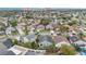 Aerial view showcasing the home's spacious backyard and a private swimming pool within a serene neighborhood at 11223 Huxley Ave, Orlando, FL 32837