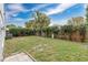 Large backyard with new grass, wood fence and mature landscaping at 11223 Huxley Ave, Orlando, FL 32837