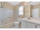 Bathroom with tub, white tile and cabinets at 11223 Huxley Ave, Orlando, FL 32837