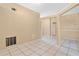 Open concept living room with tile flooring, offering plenty of space for entertaining guests at 11223 Huxley Ave, Orlando, FL 32837