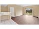 Bright living room features hardwood floors and sliding glass doors that lead to the backyard at 11223 Huxley Ave, Orlando, FL 32837