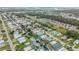 This aerial view captures the neighborhood featuring canal-front homes with boat docks and easy access to the open water at 116 Douglas St, Edgewater, FL 32141