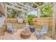 Private backyard featuring a fire pit, seating area, and storage shed at 116 Douglas St, Edgewater, FL 32141
