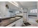 Bright bathroom with a walk-in shower, a soaking tub, a large mirror, and a vanity with a sink at 116 Douglas St, Edgewater, FL 32141