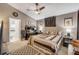 Cozy bedroom with vaulted ceiling, ceiling fan, carpet, and neutral walls at 116 Douglas St, Edgewater, FL 32141