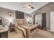 Neutral bedroom featuring carpet, ceiling fan, a window, and side tables with lamps at 116 Douglas St, Edgewater, FL 32141