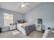 Bright bedroom with a ceiling fan, soft carpet, and calming light blue walls at 116 Douglas St, Edgewater, FL 32141