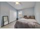 Comfortable bedroom featuring soft carpet, a ceiling fan, and neutral decor at 116 Douglas St, Edgewater, FL 32141