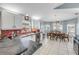Bright kitchen with white cabinets, black countertops, and an adjacent dining area, creating a warm, inviting space at 116 Douglas St, Edgewater, FL 32141