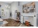 Cozy living room features a decorative fireplace, high ceilings, and a well-lit entrance with tiled floors at 116 Douglas St, Edgewater, FL 32141