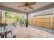 Inviting covered patio with tiled floor and outdoor seating around a fire pit at 116 Douglas St, Edgewater, FL 32141