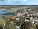 An aerial view shows the property with water views from multiple rooms at 1330 Shelter Rock Rd, Orlando, FL 32835