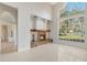 Elegant living room featuring a brick fireplace and large windows at 1330 Shelter Rock Rd, Orlando, FL 32835