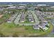 A picturesque aerial shot showcasing a residential community with water views and neatly arranged homes at 1380 Patterson Ter, Lake Mary, FL 32746