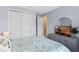 Serene bedroom features a spacious closet, dresser with a TV, and a round mirror at 1380 Patterson Ter, Lake Mary, FL 32746