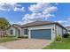 Beautiful home boasts a brick driveway leading to a two-car garage and well-maintained landscaping at 1380 Patterson Ter, Lake Mary, FL 32746