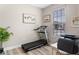 Functional home office with a treadmill, desk, and natural light at 1380 Patterson Ter, Lake Mary, FL 32746