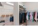 Organized walk-in closet with shelves and hanging rods for ample storage at 1380 Patterson Ter, Lake Mary, FL 32746