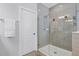 Elegant bathroom featuring a glass-enclosed shower with gray subway tile and modern fixtures at 15373 Murcott Harvest Loop, Winter Garden, FL 34787