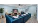 Bright living room featuring stylish furniture, a cozy fireplace, and an open layout at 15373 Murcott Harvest Loop, Winter Garden, FL 34787