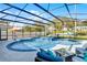 Inviting screened-in pool area with lounge chairs, umbrellas, and outdoor seating at 15373 Murcott Harvest Loop, Winter Garden, FL 34787
