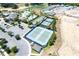 Aerial view of tennis courts, community pool, and parking spaces, highlighting the range of amenities available at 1905 Estuary Ln, Kissimmee, FL 34747
