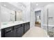 Modern bathroom with double vanity, walk-in shower, and seamless transition to the adjacent spaces at 1905 Estuary Ln, Kissimmee, FL 34747