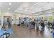 Bright and spacious gym filled with weights and exercise equipment with a view of lush landscaping at 1905 Estuary Ln, Kissimmee, FL 34747