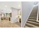 Hallway with stairs, a beverage center, and an opening into the formal living room at 1905 Estuary Ln, Kissimmee, FL 34747