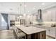 Gourmet kitchen with a large island, stainless steel appliances, and custom cabinetry at 1905 Estuary Ln, Kissimmee, FL 34747