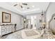 Spacious main bedroom showcasing an en-suite bathroom and ample natural light at 1905 Estuary Ln, Kissimmee, FL 34747