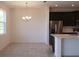 Open-concept with kitchen offering a center island, stainless steel appliances and sleek cabinetry at 2051 Town Pasture Dr, Eustis, FL 32726