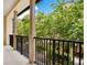 Cozy balcony offering peaceful views of lush trees and a courtyard at 2159 Bosque Aly, Orlando, FL 32814