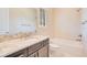 Bathroom featuring dark cabinets, granite countertops, and a shower-tub combo at 2159 Bosque Aly, Orlando, FL 32814