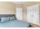 Comfortable bedroom with a plush bed, neutral walls, and a double door closet at 2328 Caravelle Cir, Kissimmee, FL 34746