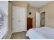 Bedroom with a large window, hardwood flooring, and double door closet at 2328 Caravelle Cir, Kissimmee, FL 34746
