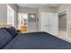 Bedroom with bathroom access, closet, warm beige walls and patterned bedspread at 2328 Caravelle Cir, Kissimmee, FL 34746
