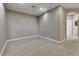 Spacious room with neutral walls, trim, and carpet with ample natural light at 2328 Caravelle Cir, Kissimmee, FL 34746
