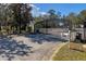 Community entrance gate with black iron fencing offers both security and curb appeal at 2328 Caravelle Cir, Kissimmee, FL 34746