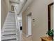 Welcoming entryway featuring a staircase, neutral walls, and tile flooring at 2328 Caravelle Cir, Kissimmee, FL 34746