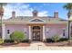 Community clubhouse exterior showcasing a well-manicured lawn and welcoming entrance at 2328 Caravelle Cir, Kissimmee, FL 34746