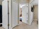 Hallway with multiple entryways, neutral walls and carpet at 2328 Caravelle Cir, Kissimmee, FL 34746