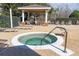 Inviting outdoor hot tub with a relaxing lounge area and covered gazebo for ultimate comfort at 2328 Caravelle Cir, Kissimmee, FL 34746