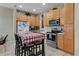 Modern kitchen featuring stainless steel appliances and a cozy breakfast nook for casual dining at 2328 Caravelle Cir, Kissimmee, FL 34746