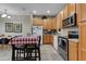 Well-lit kitchen with stainless steel appliances and ample counter space for culinary enthusiasts at 2328 Caravelle Cir, Kissimmee, FL 34746