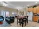 Inviting living space blending the kitchen and living area, fostering a warm, communal atmosphere at 2328 Caravelle Cir, Kissimmee, FL 34746